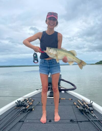 Angler with largemouth bass caught on a Bass Boats 4 Sale day trip